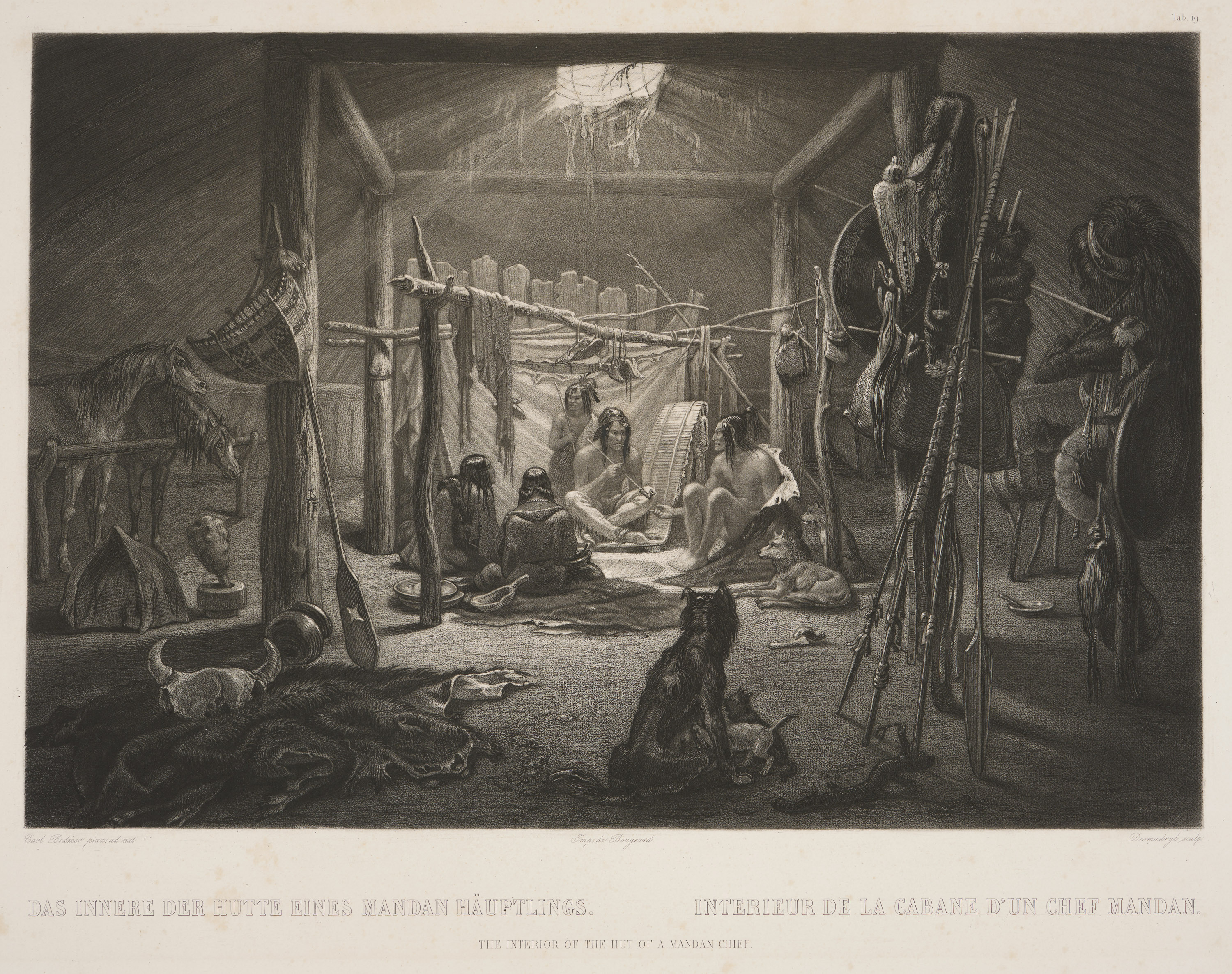 A black-and-white print of several Indigenous people, dogs, and horses inside of a wood structure; hunting equipment, hides, and other items scattered around.