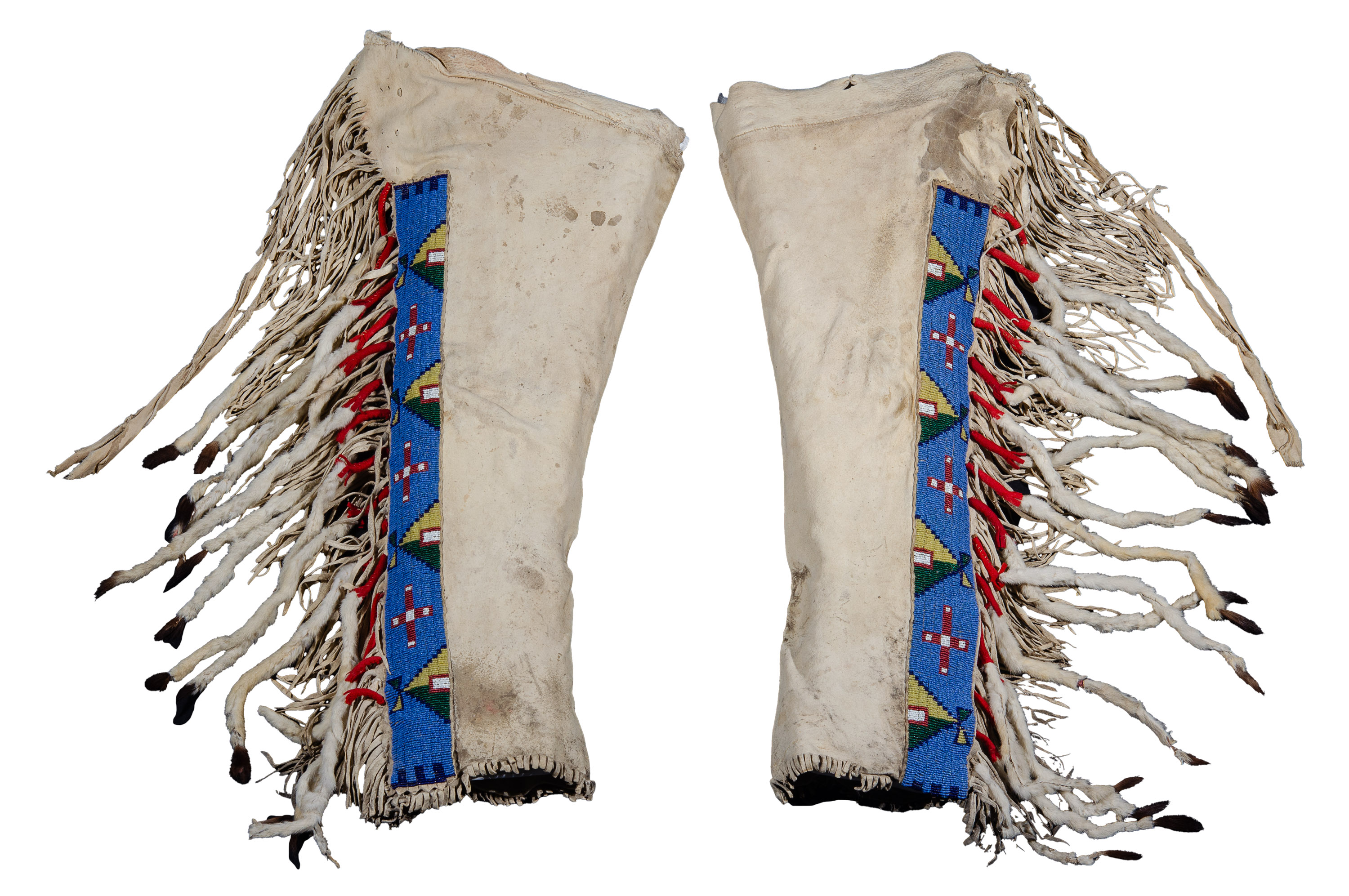 A pair of animal skin leggings with fringe down the sides and colorful beaded designs in blue, yellow, green, and red.